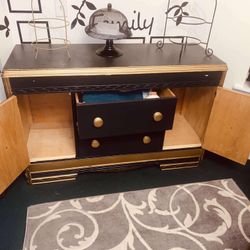  $180- (firm on price)1 Black and gold Vintage dresser! Lots of storage space behind each side door. H-2‘10“ X L 4 ft 4 1/2” X D 1‘7“  Could use a rep