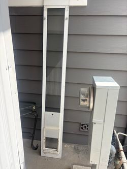 Dog door for sliding glass
