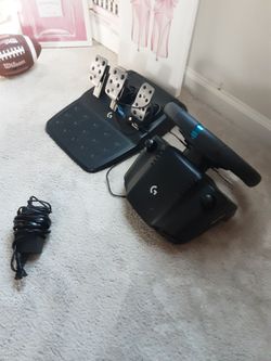 G23 Logitech Steering Wheel With Cluch, Brake, And Gas Pedals.