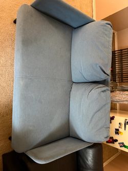 Light Blue Fabric Loveseat Sofa and black couches