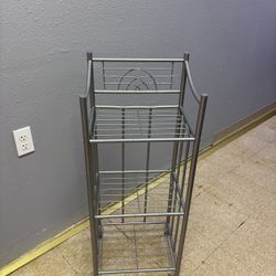 small bathroom metal shelving unit silver in color