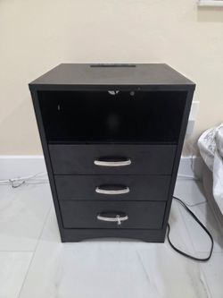 3-drawer nightstand with a built-in charging station and open top shelf.