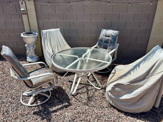 48” Glass top Patio table with 4 rocking/swivel chairs