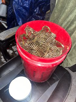 Bucket of framing nails and 4 Tubes of Sealant