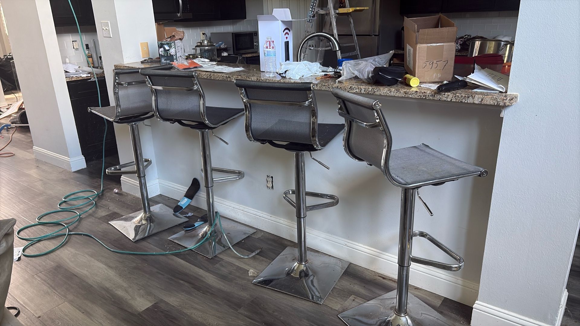 adjustable swivel bar stools with chrome bases and mesh backrests