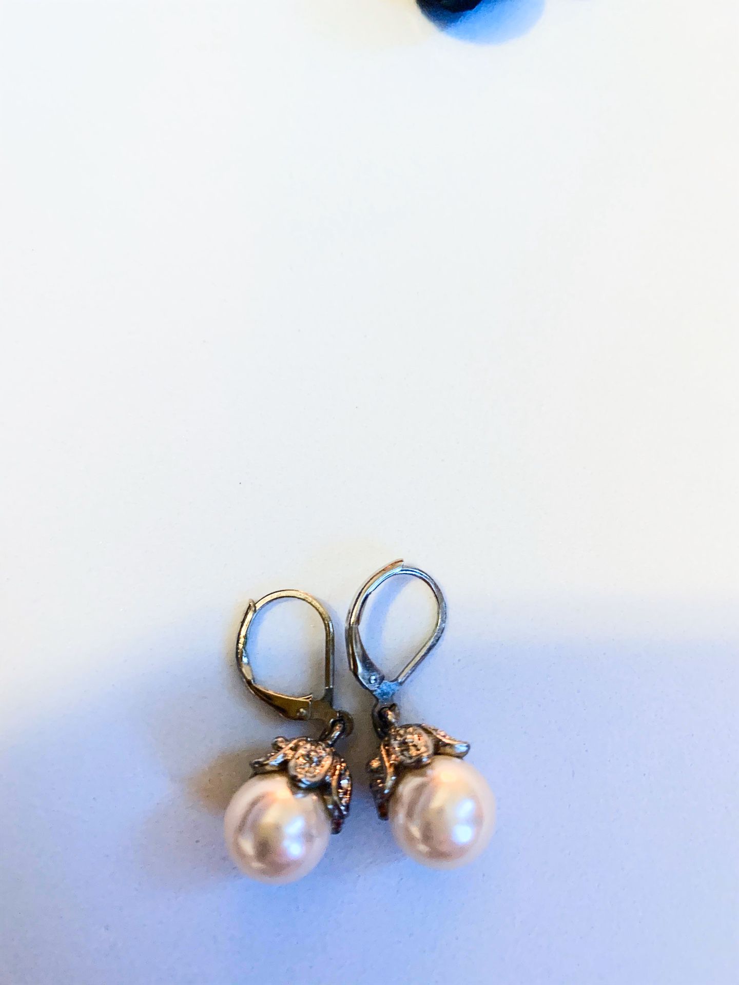 Pearl earrings with small diamonds