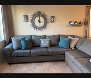 Beautiful and comfortable Grey sectional couch from Jerome’s