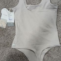 Woman's Body Suit And Women's Shorts
