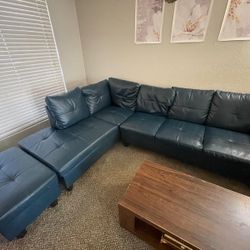 Faux Leather Couch. L-shaped With Ottoman. Minor Wear And Tear. Still Looks Brand New. Must Pick Up, No Delivery.