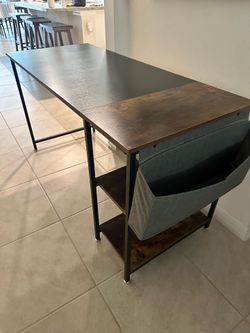 Modern Black and brown wood office desk with side pocket storage.