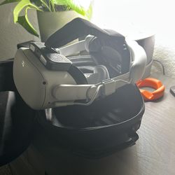Oculus quest 2 with battery pack, attachable fan, and a case