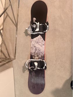 Snowboard with boots and suit included.