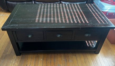 Wooden coffee table with drawers