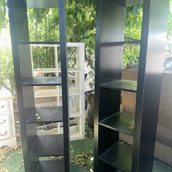 Tall, black shelves, good condition we sell all the time