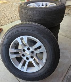 18-inch factory original Chevrolet Tahoe Silverado 6-lug aluminum wheels with used Goodyear Wrangler tires,