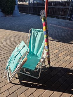 Two beach chairs and umbrella