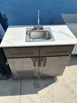 Wood cabinet with small sink