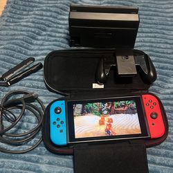 Nintendo switch with crashing N Sane Trilogy  game, docking station, joycon grip and hdmi