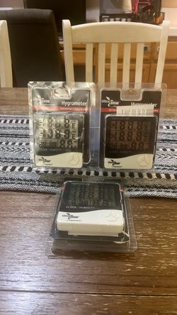 of 3 Ultra Grow by Plantmax digital hygrometers, each displaying temperature, clock, and humidity readings