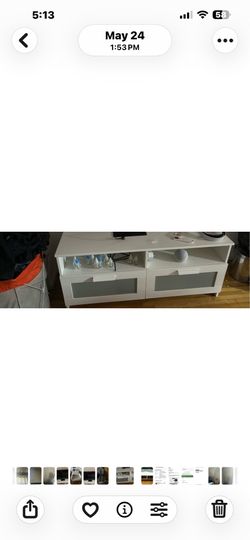 White tv stand with glass front working draws.  Shelves for storage .