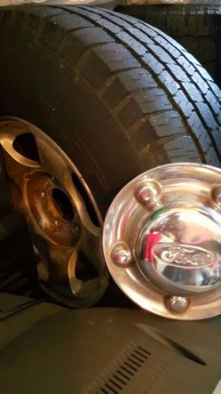 4 rims and tires from a 2002 Ford Expedition