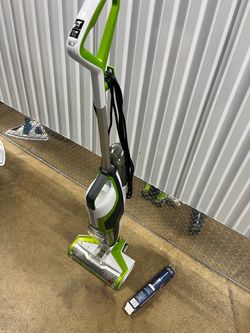 green and white BISSELL CrossWave multi-surface wet and dry vacuum cleaner