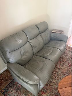Power reclining leather couch