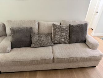 Large Beige Fabric Sofa with Throw Pillow