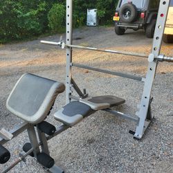 Home Gym. Adjustable Bench/Rack, Olympic Bar, Olympic Curl Bar, and 240 Pounds Of Olympic Plates