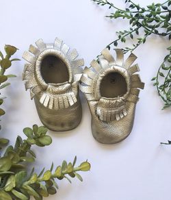 Gold moccasins size 2