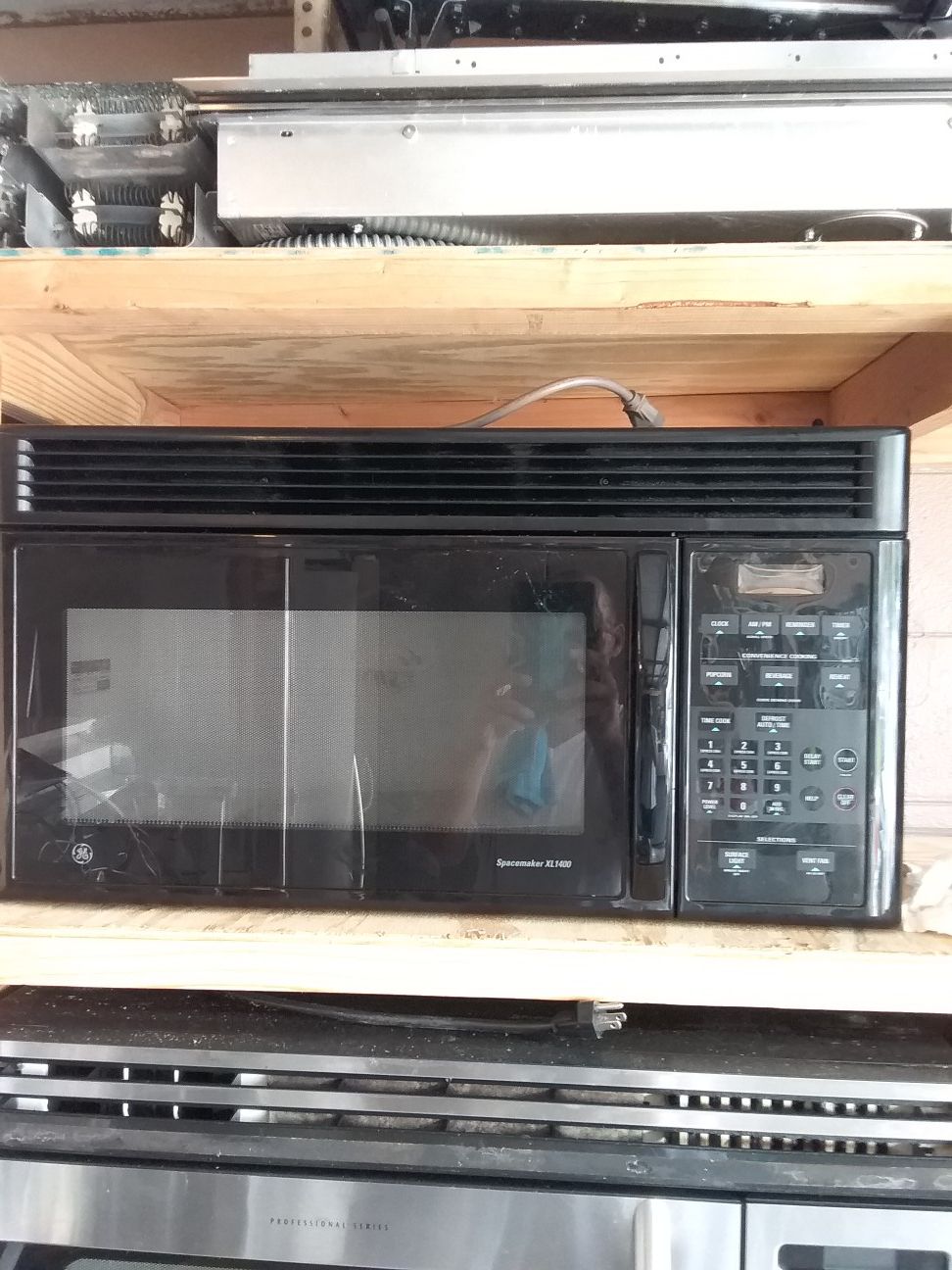 Black ge over the range microwave bracket and screws included in good working condition