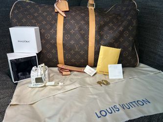 Used once LV original travel bag with a pandora ornament!