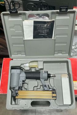 NuMax pneumatic 2-in-1 brad nailer and stapler kit in a gray plastic carry case.