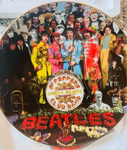This is a Bradford Exchange collector plate celebrating the 25th anniversary of The Beatles' Sgt. Pepper's Lonely Hearts Club Band album