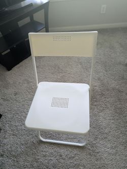 White plastic chair with metal frame