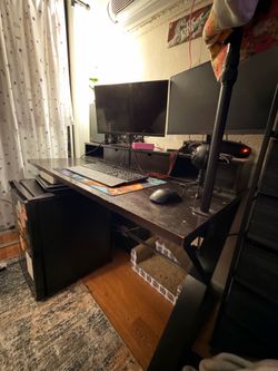 Wooden desk with monitor riser