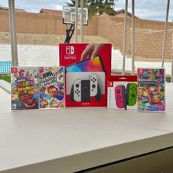Nintendo switch Oled with extra controller and 3 Mario games floor model 