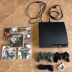 Play Station 3 with Two Remotes and Multiple Games