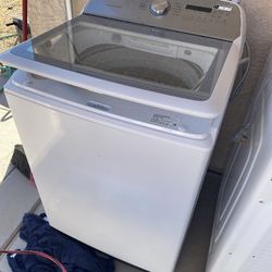 Expensive washer and dryer And a leather recliner couch