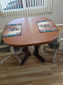 Table with extra leaf and two chairs