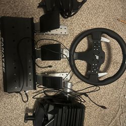 Fanatec CSL DD with 8nm boost kit and CSL pedal Load Cell Kit.