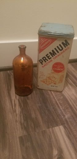 Antique Clorox Bottle and antique tin can Saltine Crackers