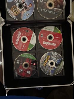 Case full of xbox 360 and wii games