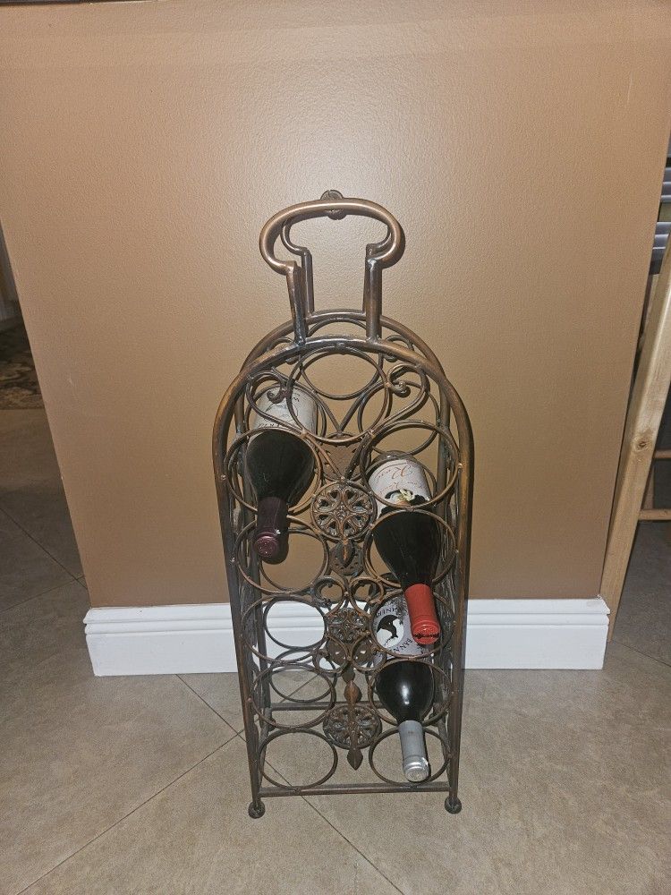 WINE RACK. 11 BOTTLE CAPACITY. 30 INCHES TALL BY 10 INCHES WIDE