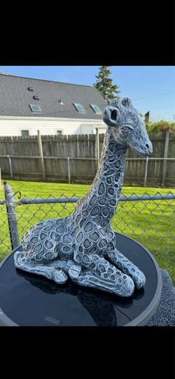 Giraffe statue sold separately