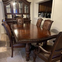 Antoinette Collection by Steve Silver. Traditional Rich Brown Buffet with China Hutch including  Rectangular Dining Table with leaf and 6 Leather Chai