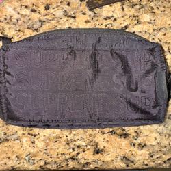 Supreme fanny pack, and Louis Vuitton keychain