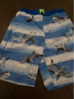 Wonder Nation blue shark print swim trunks with a bright yellow drawstring sz 14/16