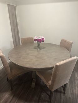60” wood round table with matching chairs and covers