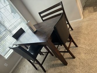 Adjustable  Dark wooden table w/ 3 chairs and a bench 